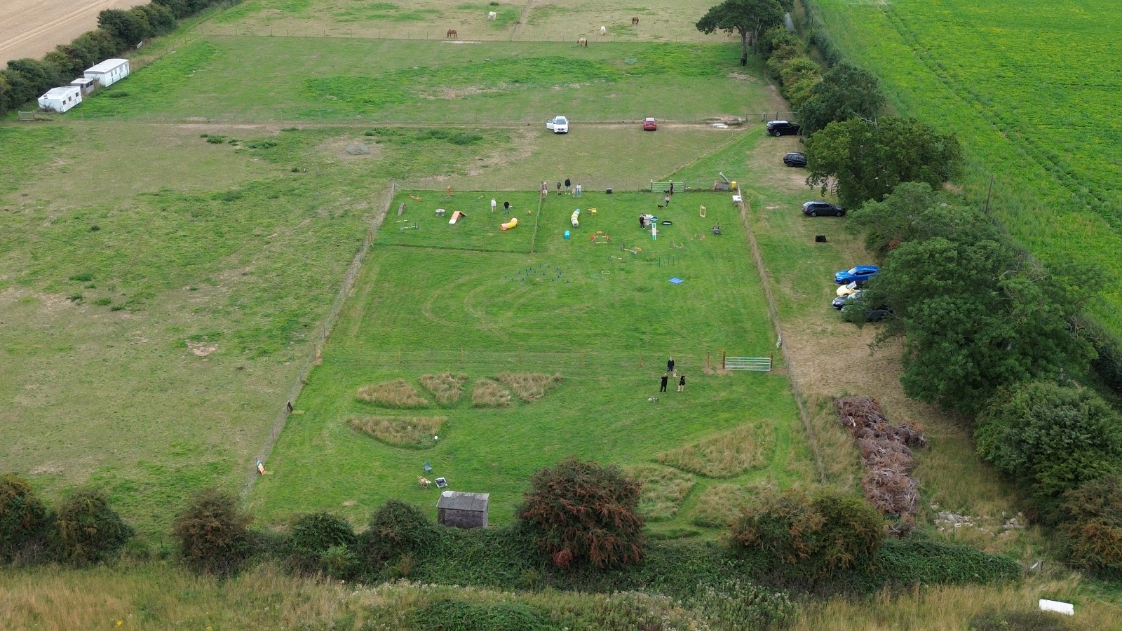 Aerial view of the training field set up with agility equipment during a session